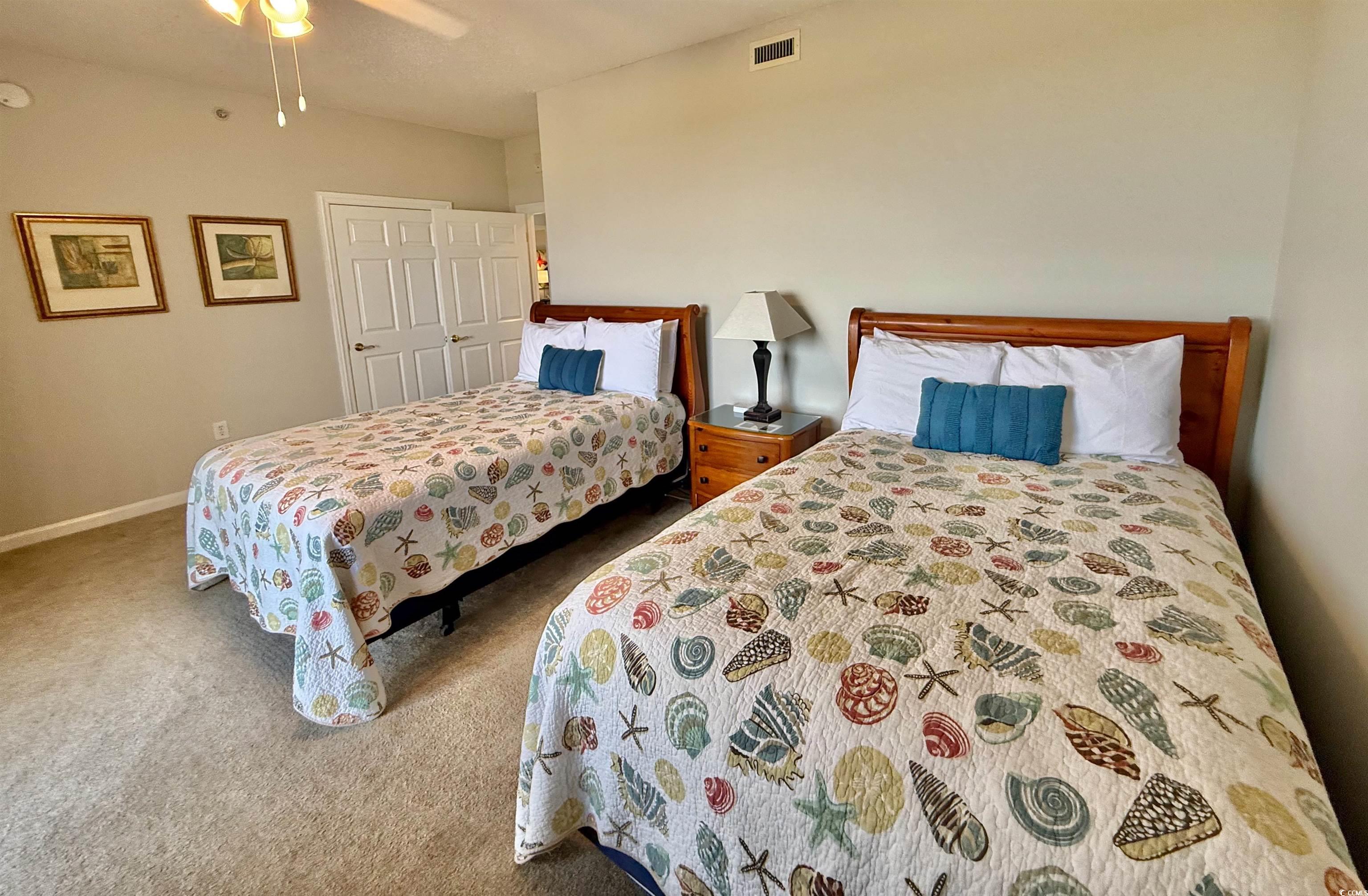 8500 Margate Circle, Unit 1108 Myrtle Beach, SC 29572 - Photo 29 of 40 Carpeted bedroom with a ceiling fan and baseboards