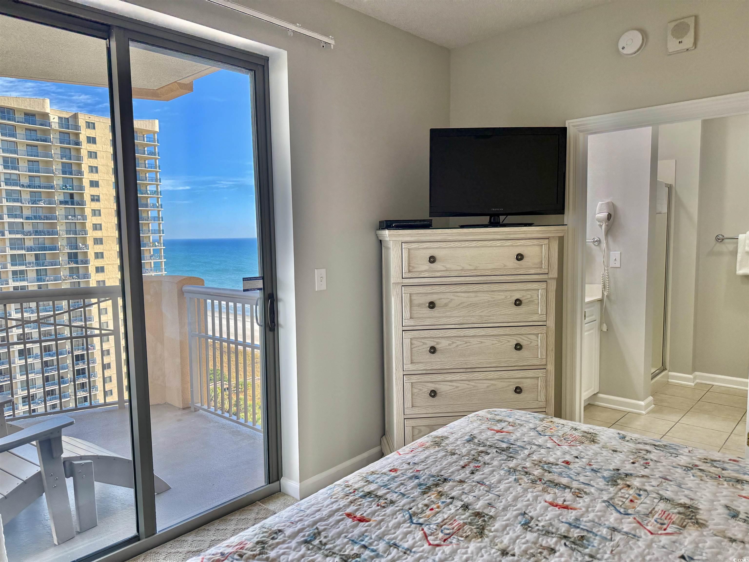 8500 Margate Circle, Unit 1108 Myrtle Beach, SC 29572 - Photo 37 of 40 Bedroom featuring access to outside and light tile patterned flooring