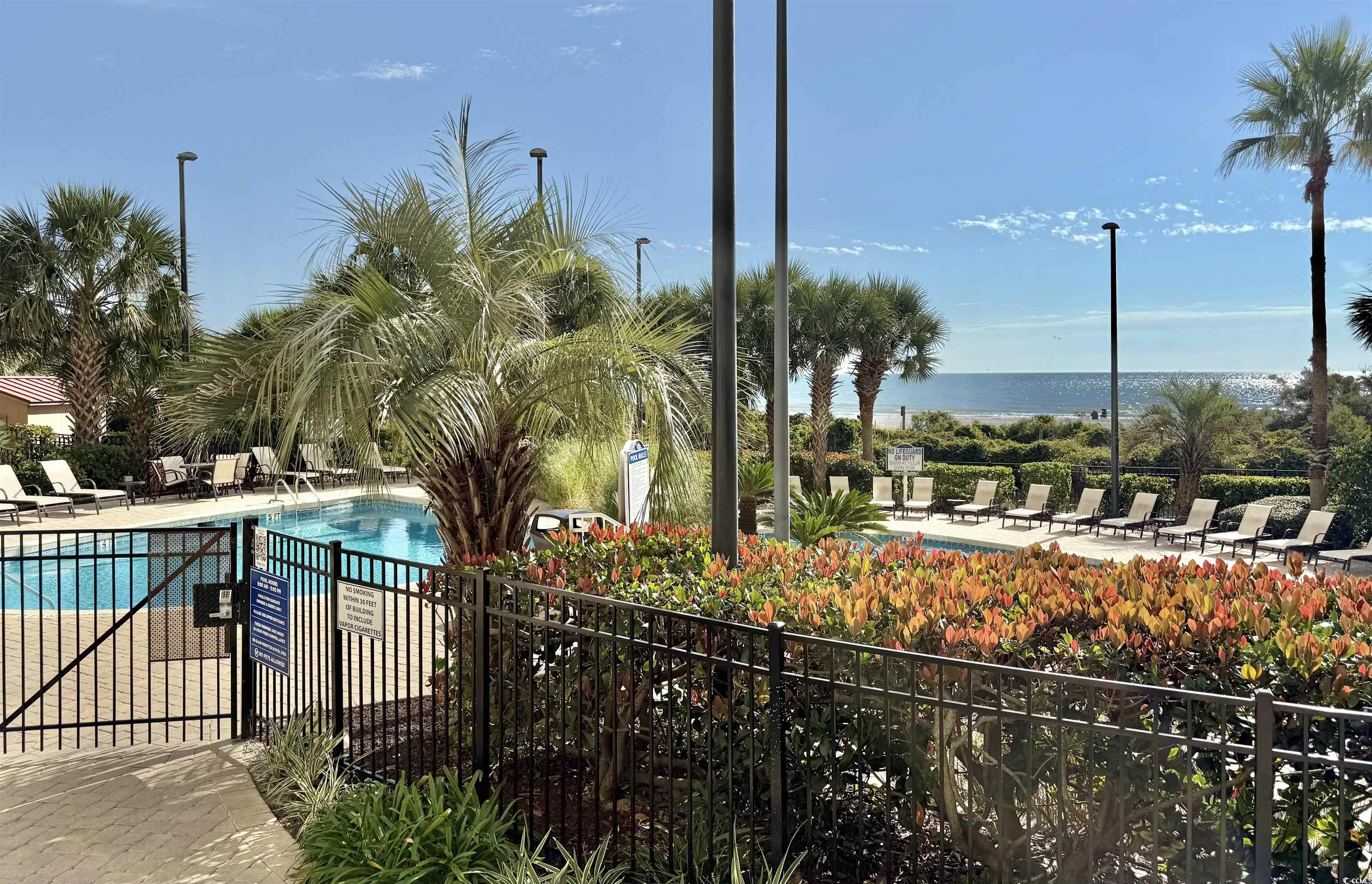 8500 Margate Circle, Unit 1108 Myrtle Beach, SC 29572 - Photo 39 of 40 Community pool with a patio area and a water view
