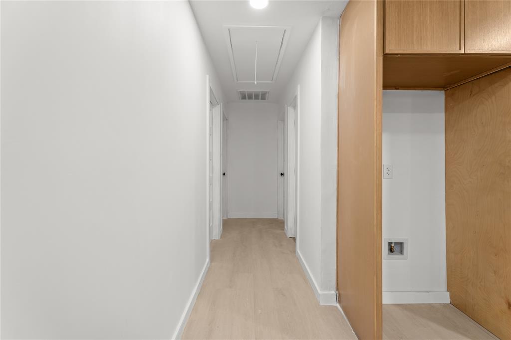 110 Hackberry Street Lancaster, TX 75146 - Photo 28 of 32 Hallway with light wood-finish flooring, white walls, and recessed lighting