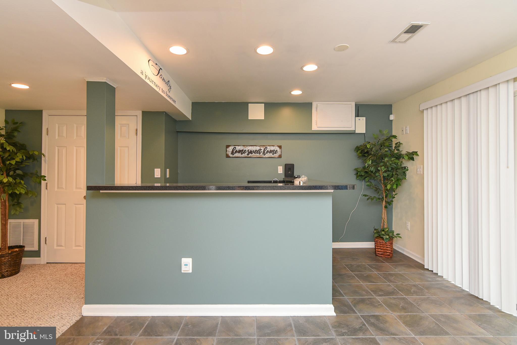 6053 Igo Road King George, VA 22485 - Photo 34 of 44 Basement Wet Bar with Walk Out to Lower Back Deck