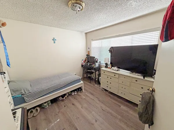a room with furniture and flat screen tv