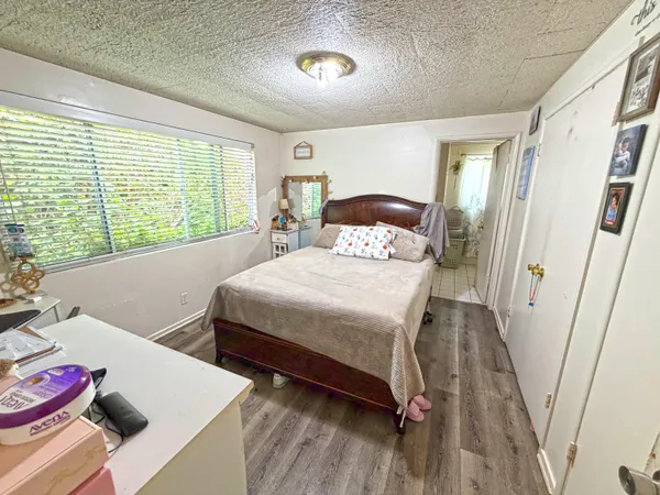 a bedroom with a bed and a table