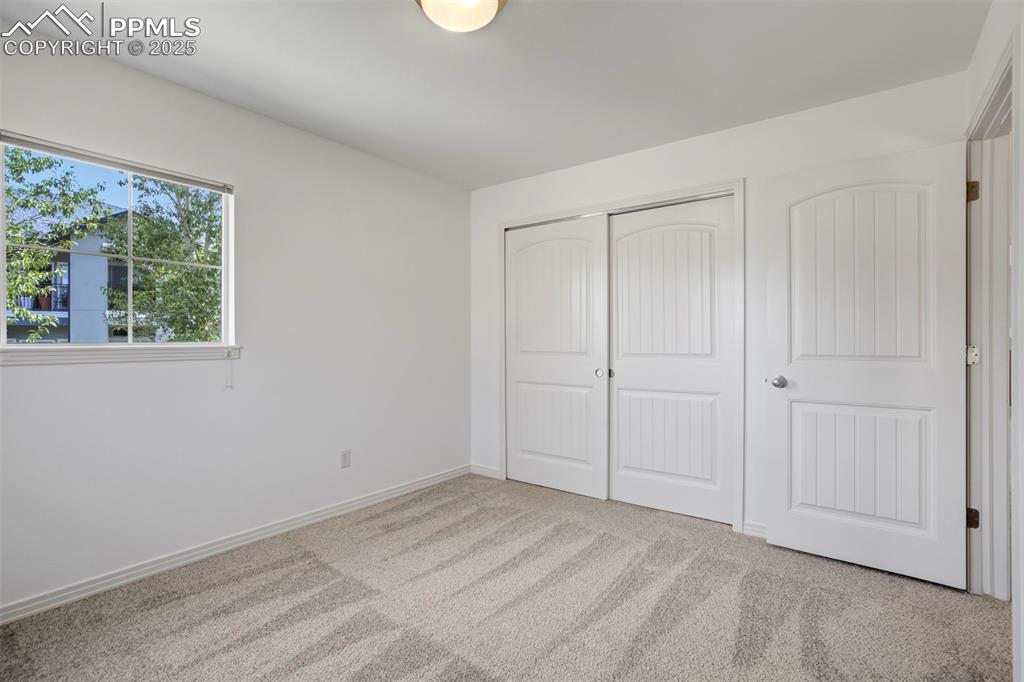1571 Promontory Bluff View Colorado Springs, CO 80921 - Photo 27 of 49 a view of an empty room with a window