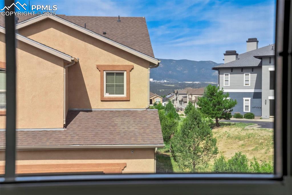 1571 Promontory Bluff View Colorado Springs, CO 80921 - Photo 28 of 49 a front view of house with yard and trees