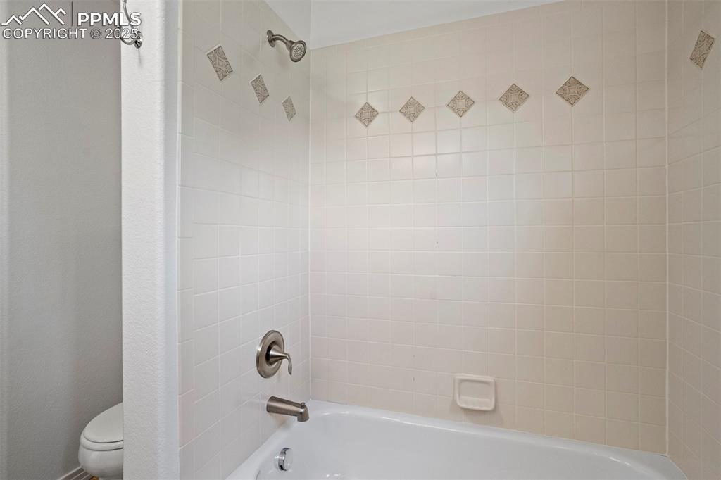 1571 Promontory Bluff View Colorado Springs, CO 80921 - Photo 33 of 49 a bathroom with a bathtub