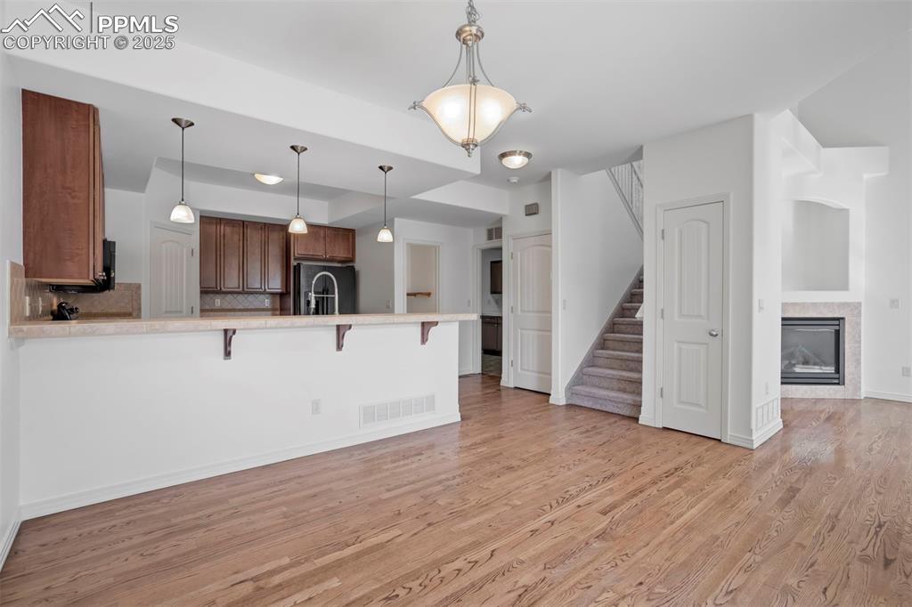 1571 Promontory Bluff View Colorado Springs, CO 80921 - Photo 8 of 49 a view of a kitchen with a sink and a large mirror