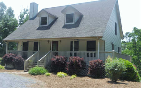 548 Ruby Ridge Drive Talking Rock, GA 30175 - Photo 1 of 1 a front view of a house with a garden