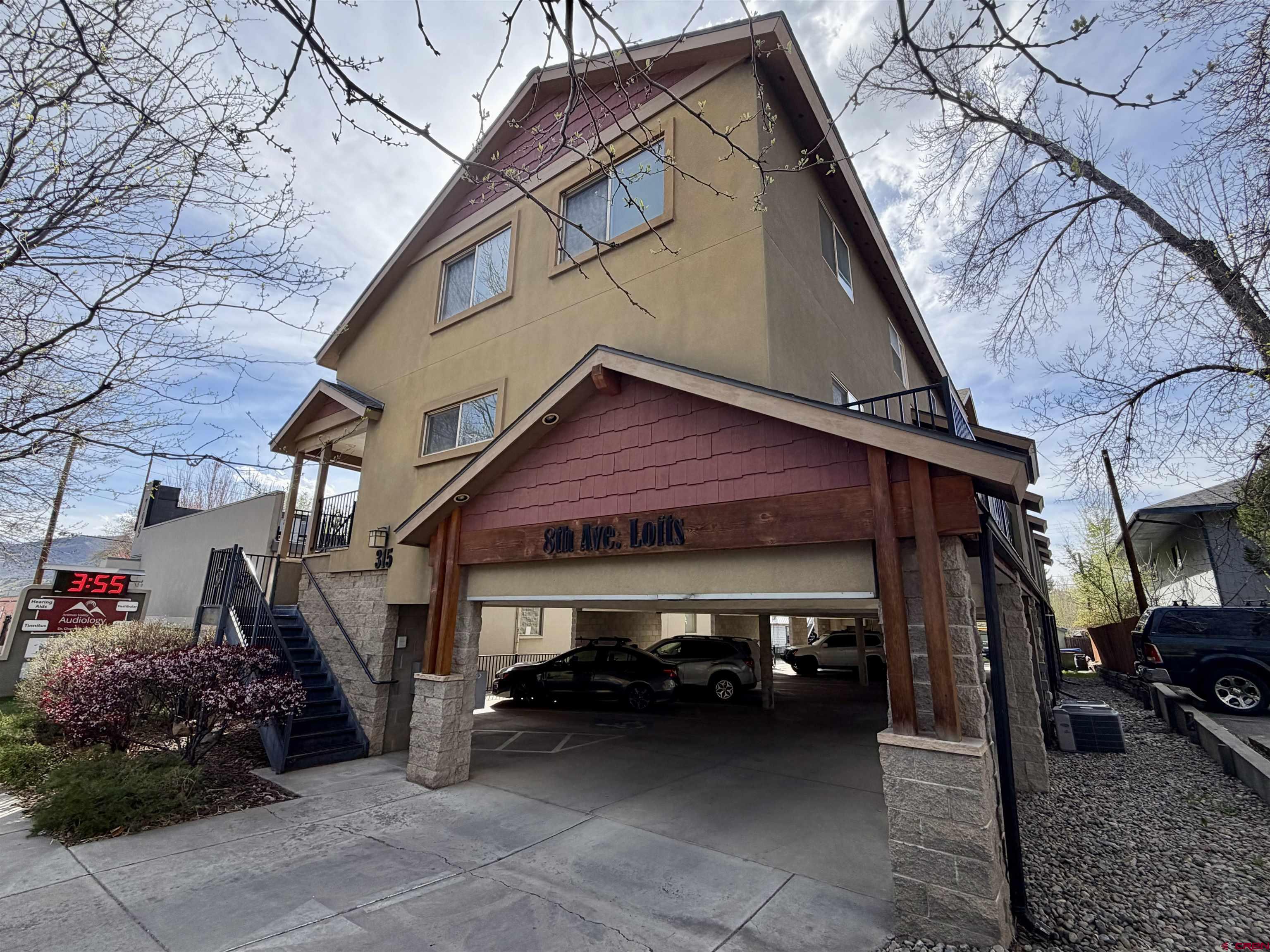 315 East 8th Avenue, Unit 203 Durango, CO 81301 - Photo 1 of 15 a view of a car park in front of house