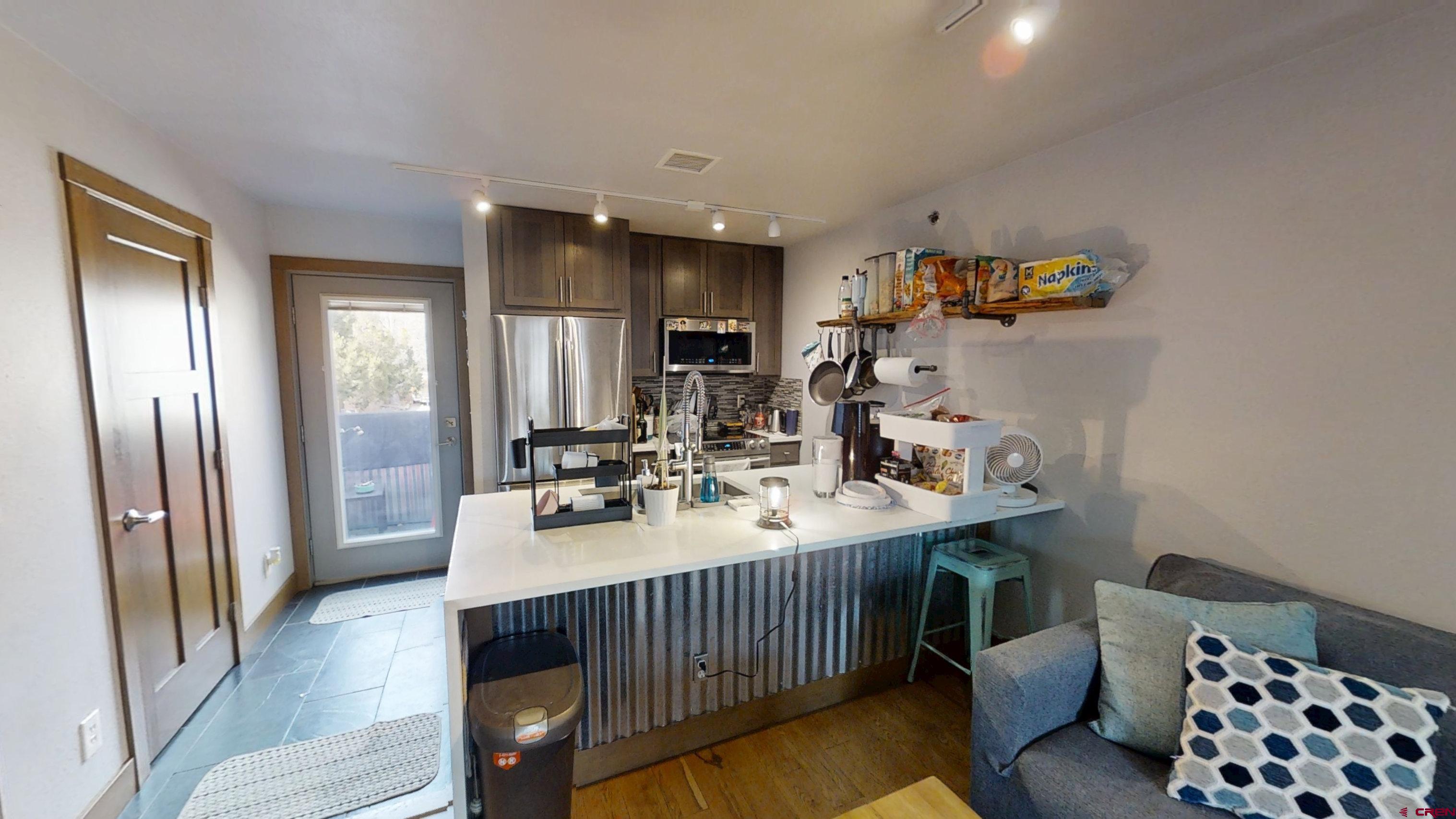 315 East 8th Avenue, Unit 203 Durango, CO 81301 - Photo 7 of 15 a view of a kitchen from the dinning room
