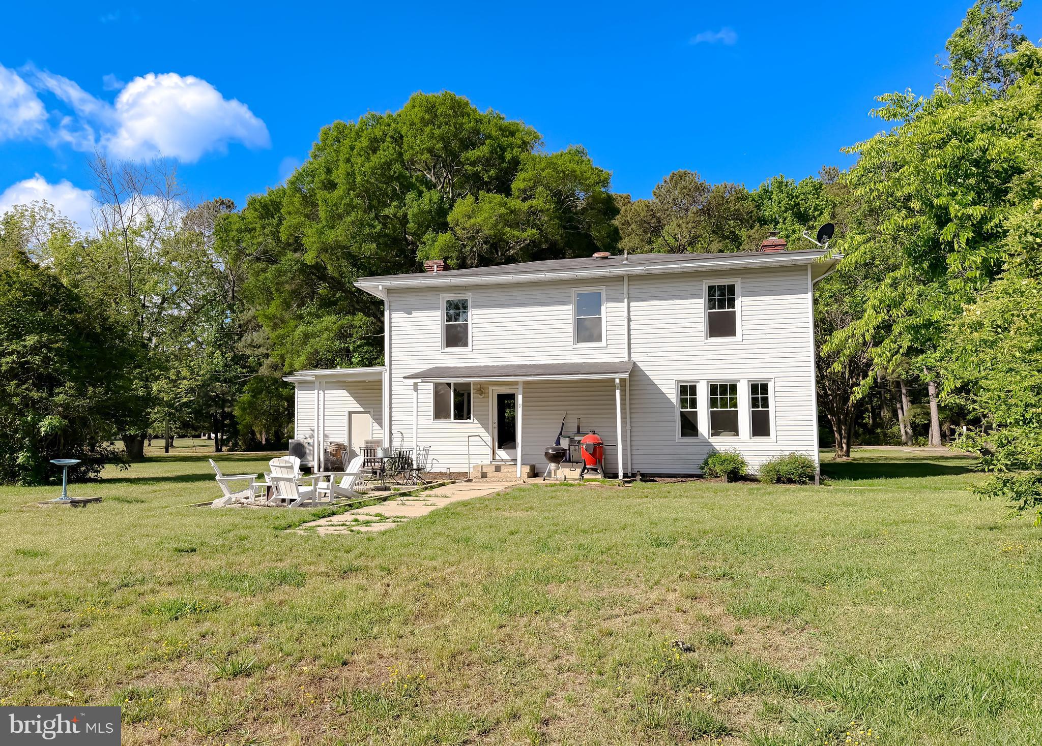 16146 Thomas Road Piney Point, MD 20674 - Photo 55 of 57 a view of a house with backyard sitting area and garden