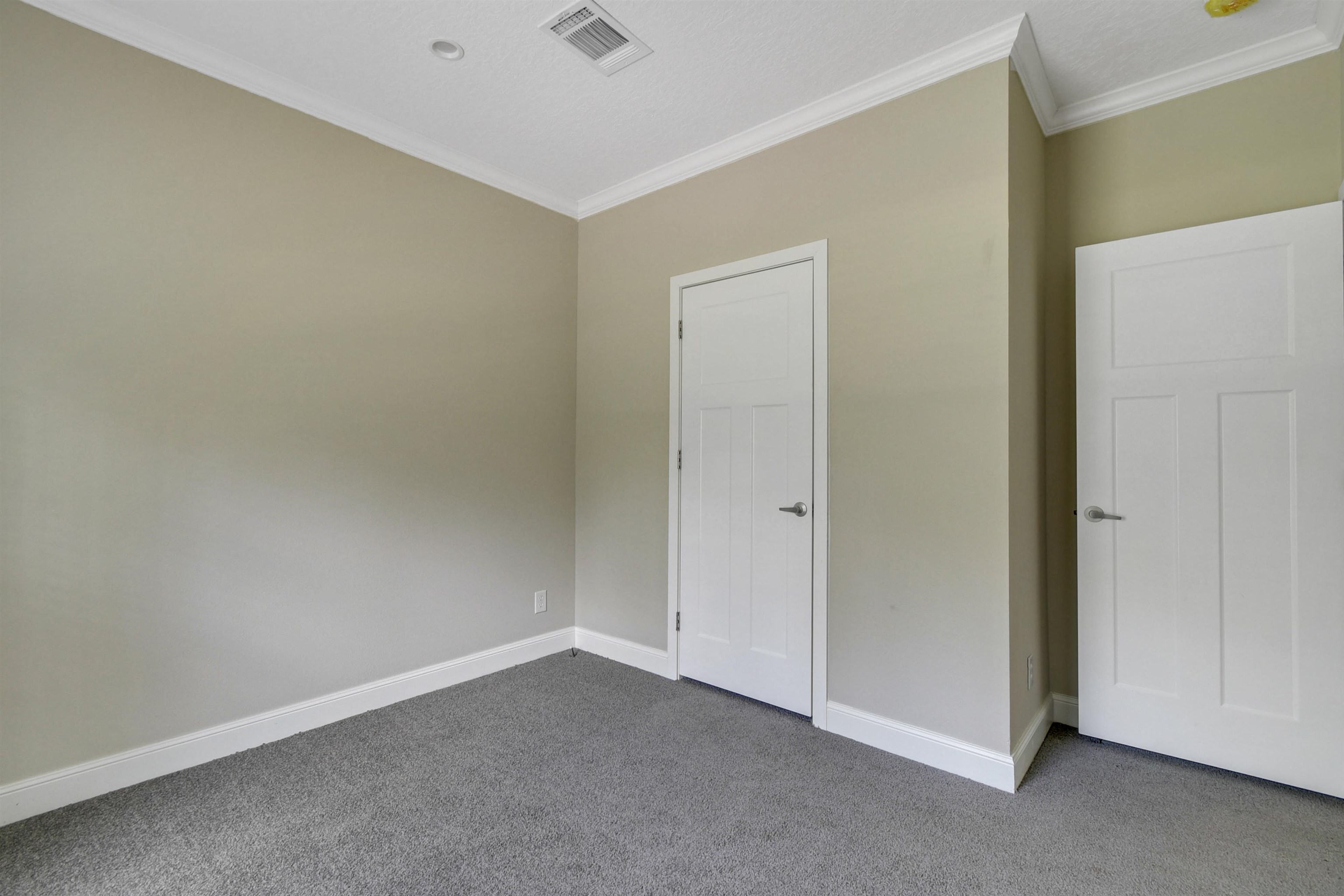 4240 Isaac Street Hastings, FL 32145 - Photo 10 of 19 Unfurnished bedroom featuring ornamental molding and carpet