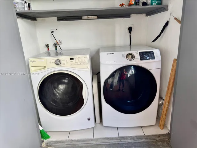 a utility room with dryer and washer