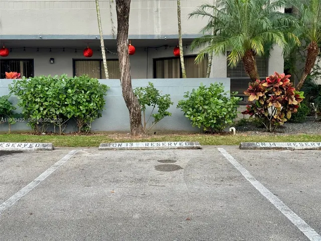 a view of a swimming pool with a yard