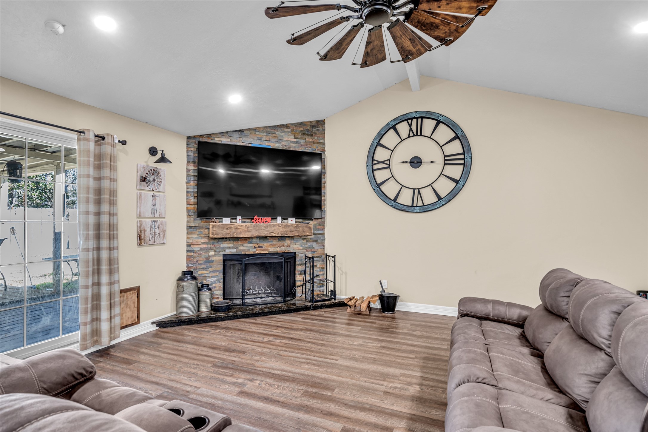 25473 White Oak Lane Splendora, TX 77372 - Photo 11 of 24 Another view of living space with wood burning fireplace and high ceilings