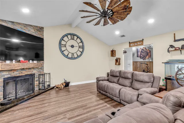 a living room with furniture and a fireplace