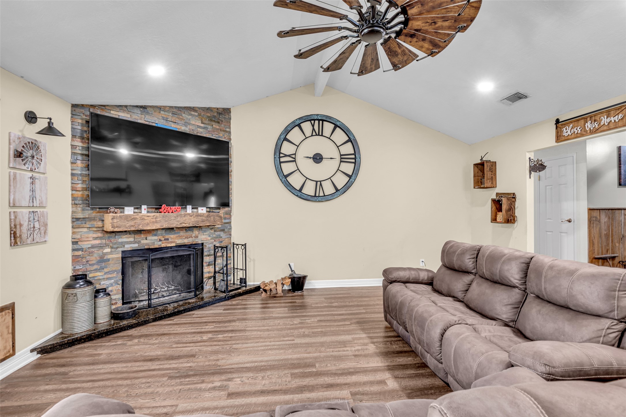 25473 White Oak Lane Splendora, TX 77372 - Photo 10 of 24 Wood-burning fireplace with a custom hand-carved beam mantel