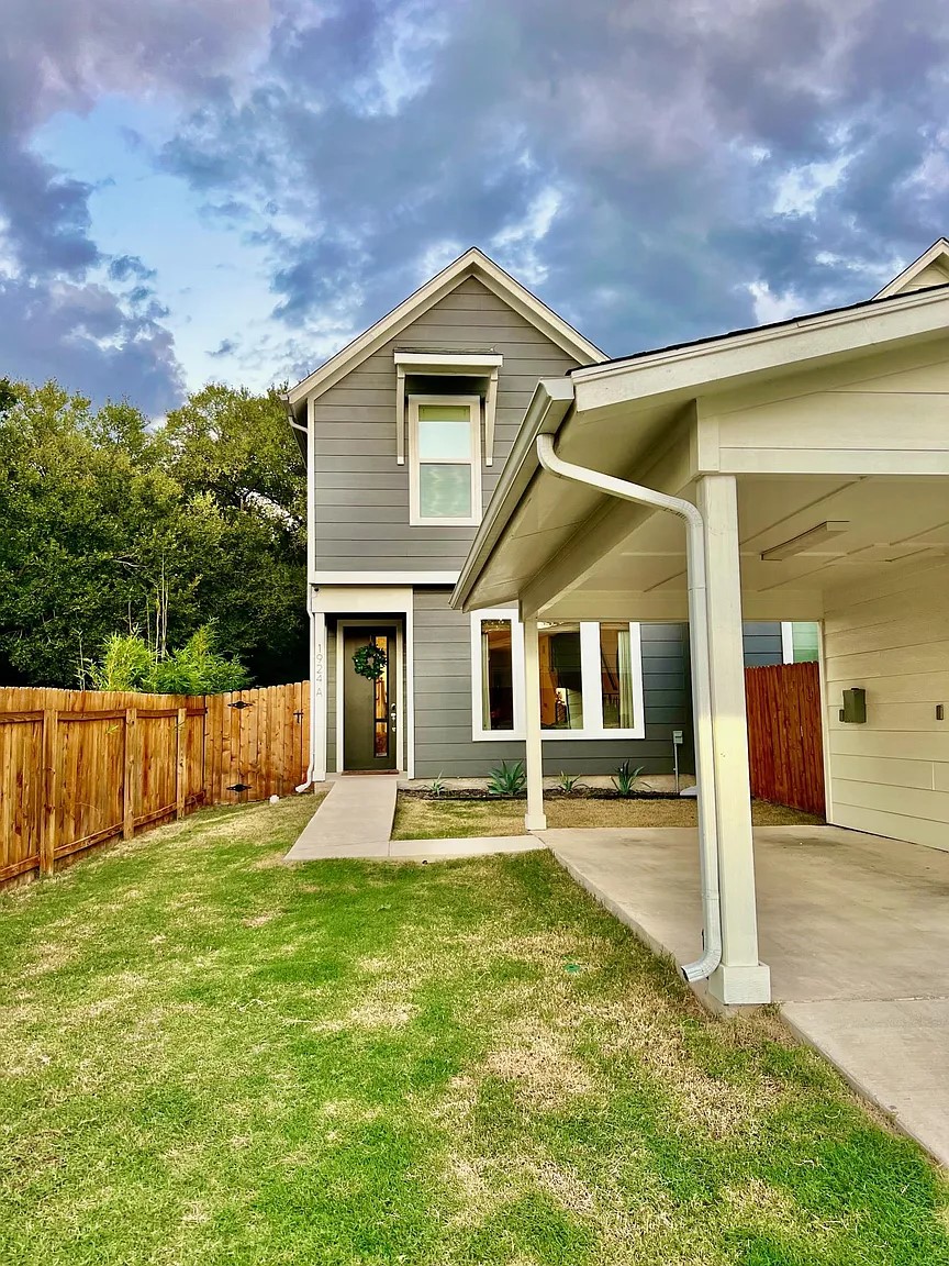 View of front of house with a carport