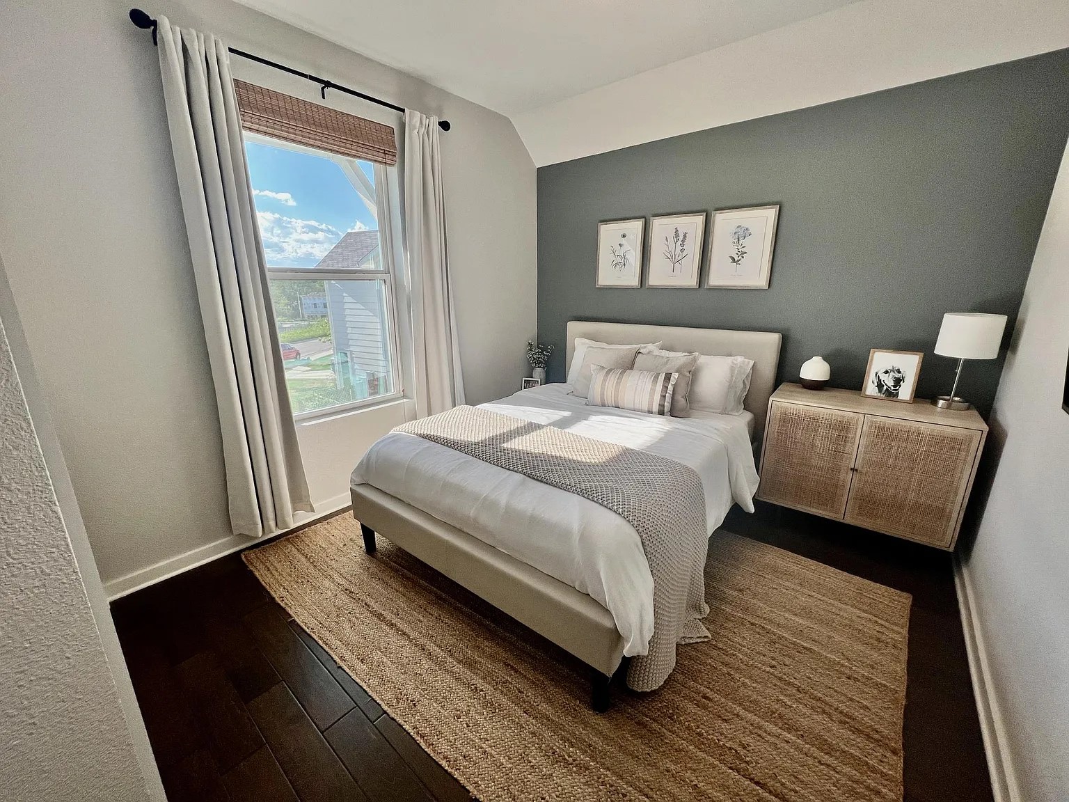 1924 Bunche Road, Unit A Austin, TX 78721 - Photo 10 of 14 Bedroom with wood-type flooring, vaulted ceiling, and an accent wall