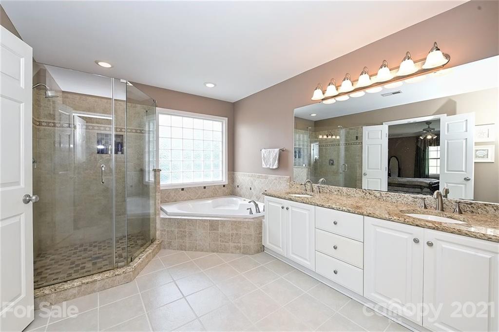 324 Gringley Hill Road Fort Mill, SC 29708 - Photo 19 of 48 a spacious bathroom with a double vanity sink mirror and shower