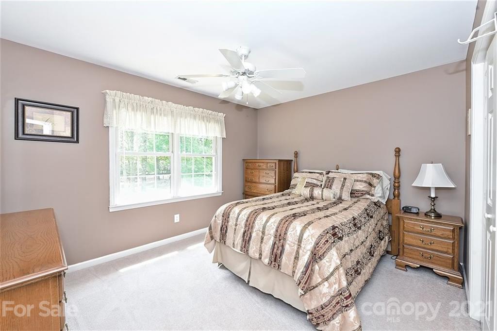 324 Gringley Hill Road Fort Mill, SC 29708 - Photo 21 of 48 a bedroom with a bed and a window