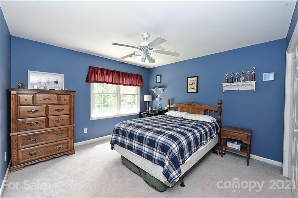 324 Gringley Hill Road Fort Mill, SC 29708 - Photo 23 of 48 a bedroom with a bed and a window