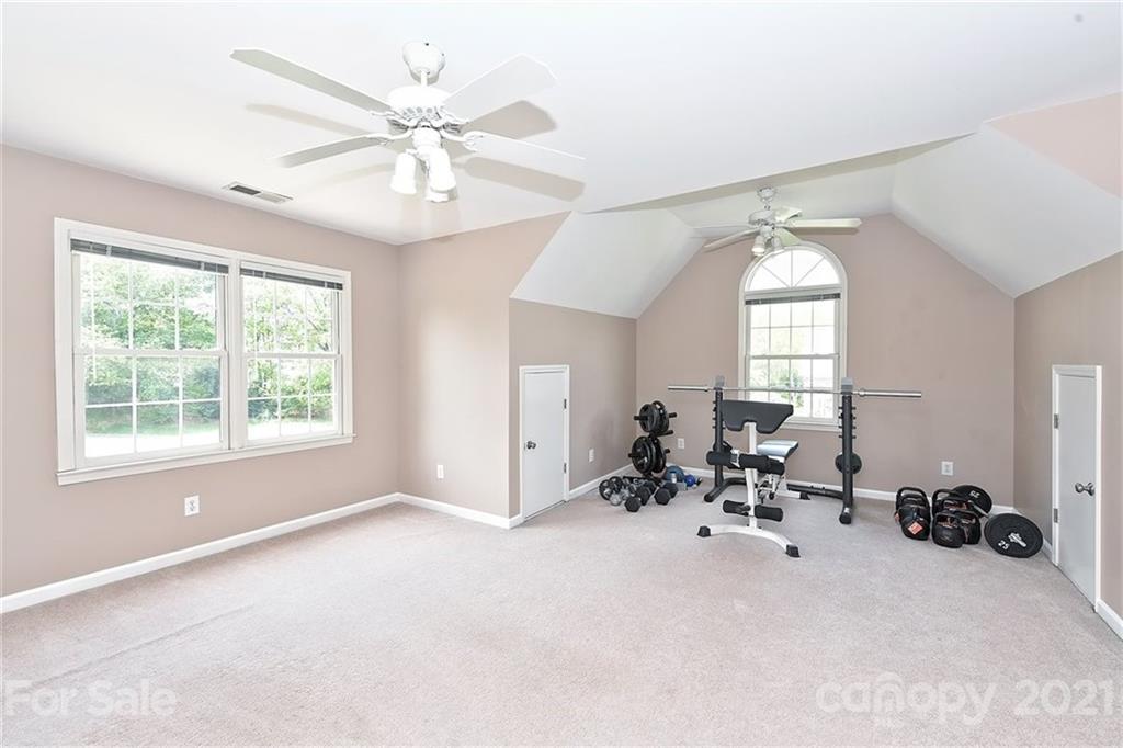 324 Gringley Hill Road Fort Mill, SC 29708 - Photo 25 of 48 a view of a livingroom with window hardwood floor and a ceiling fan