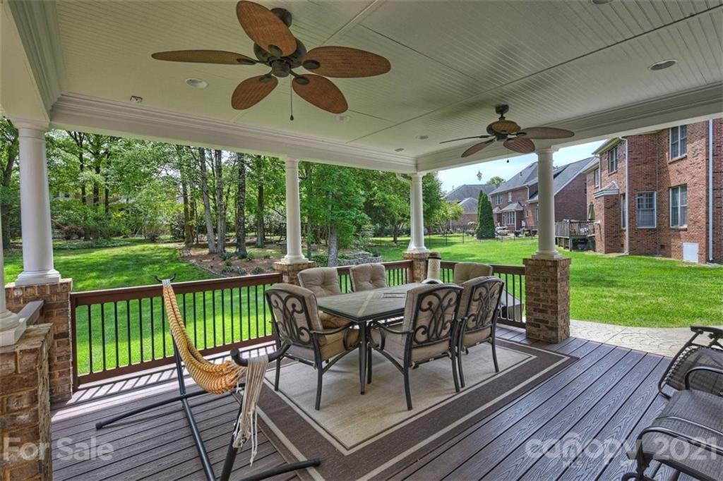 324 Gringley Hill Road Fort Mill, SC 29708 - Photo 27 of 48 a view of a patio with a table chairs and backyard
