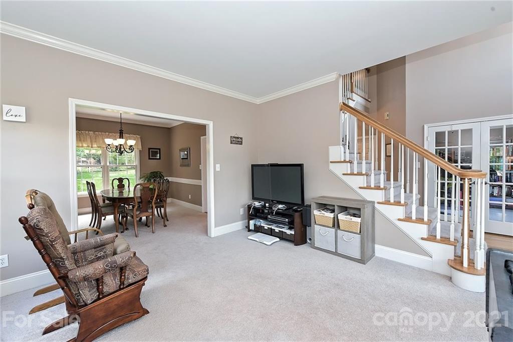 324 Gringley Hill Road Fort Mill, SC 29708 - Photo 6 of 48 a living room with furniture and a flat screen tv