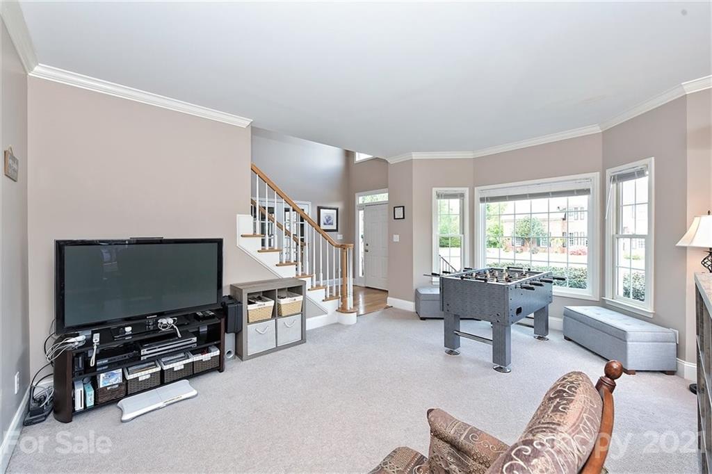 324 Gringley Hill Road Fort Mill, SC 29708 - Photo 7 of 48 a living room with furniture and a flat screen tv