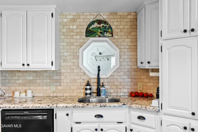 a bathroom with a toilet and a shower curtain