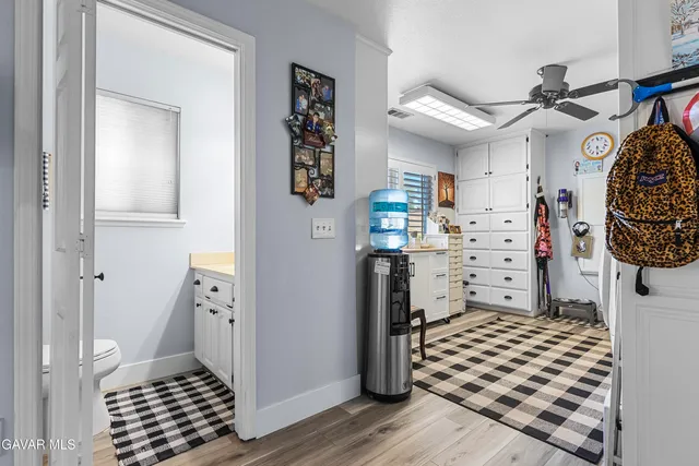 a en suite bathroom with double vanity and mirrors