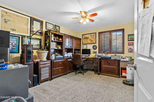 a view of a house with a snow in the background