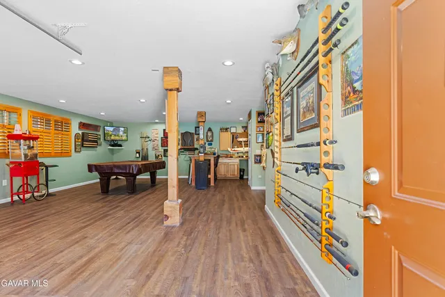 a front view of a house with a yard and a garage