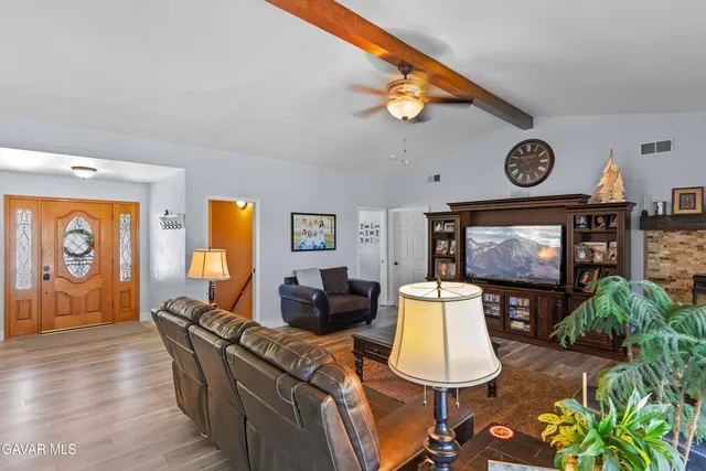 a view of a dining room with furniture wooden floor and chandelier