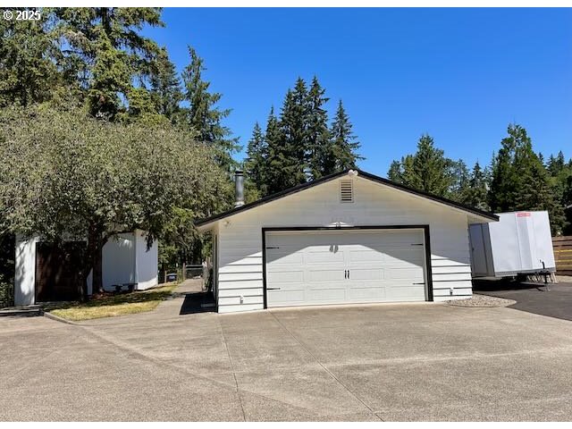 19306 Northwest 11th Avenue Ridgefield, WA 98642 - Photo 22 of 34 a front view of a house with a yard and garage