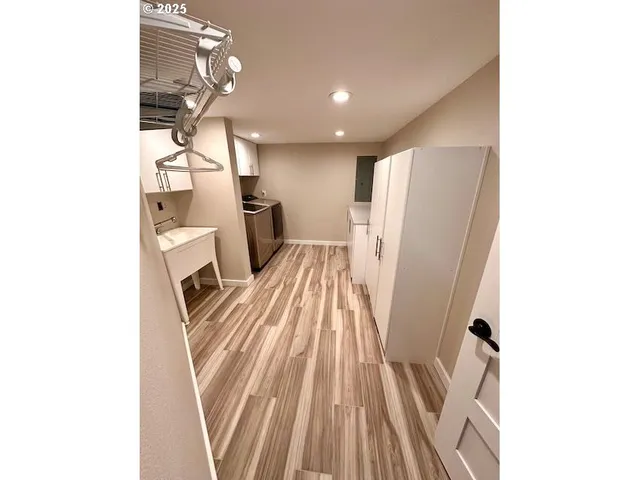 a living room with furniture and a mirror