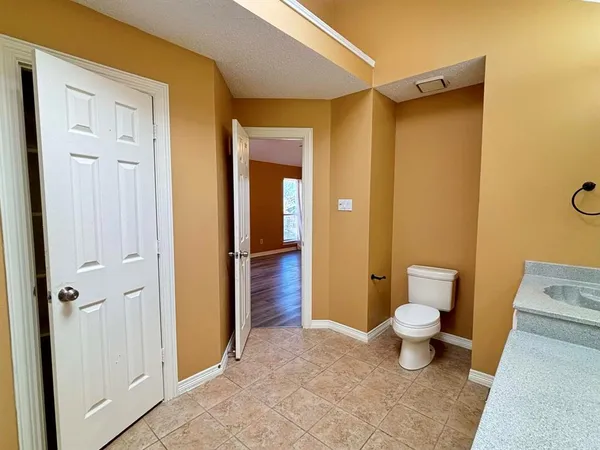 a bathroom with a toilet sink and shower