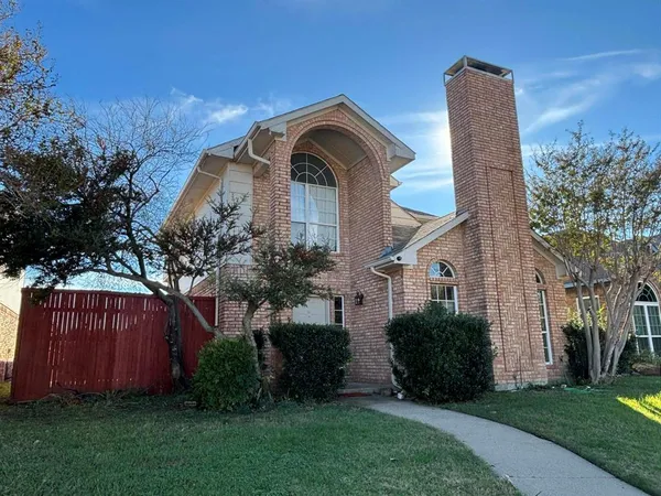 a view of a front of a house with a yard