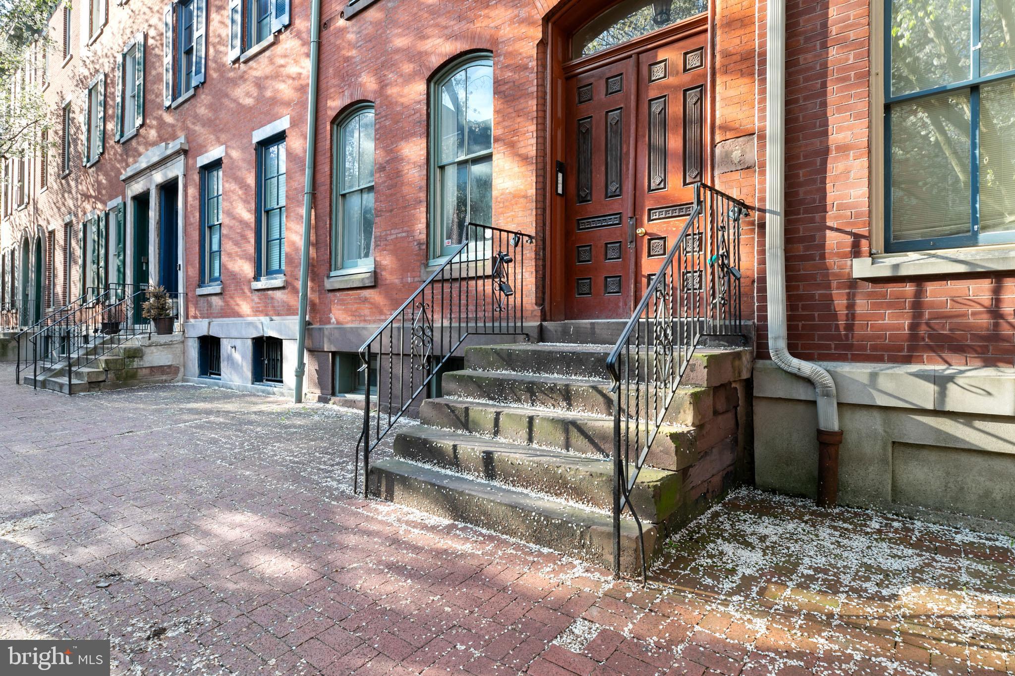 a view of a brick building with many windows