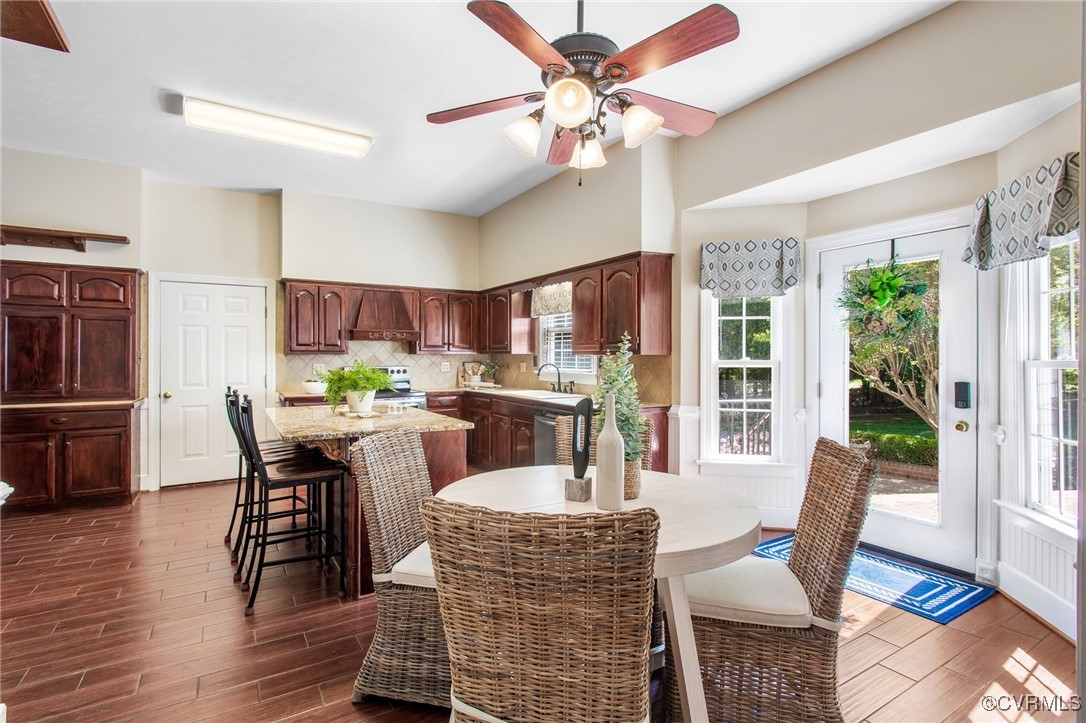 2949 Sandy Hook Road Sandy Hook, VA 23153 - Photo 18 of 49 a dining room with furniture a window and wooden floor