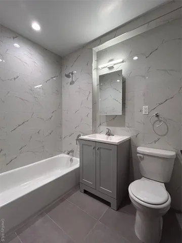 a bathroom with a sink toilet and bathtub