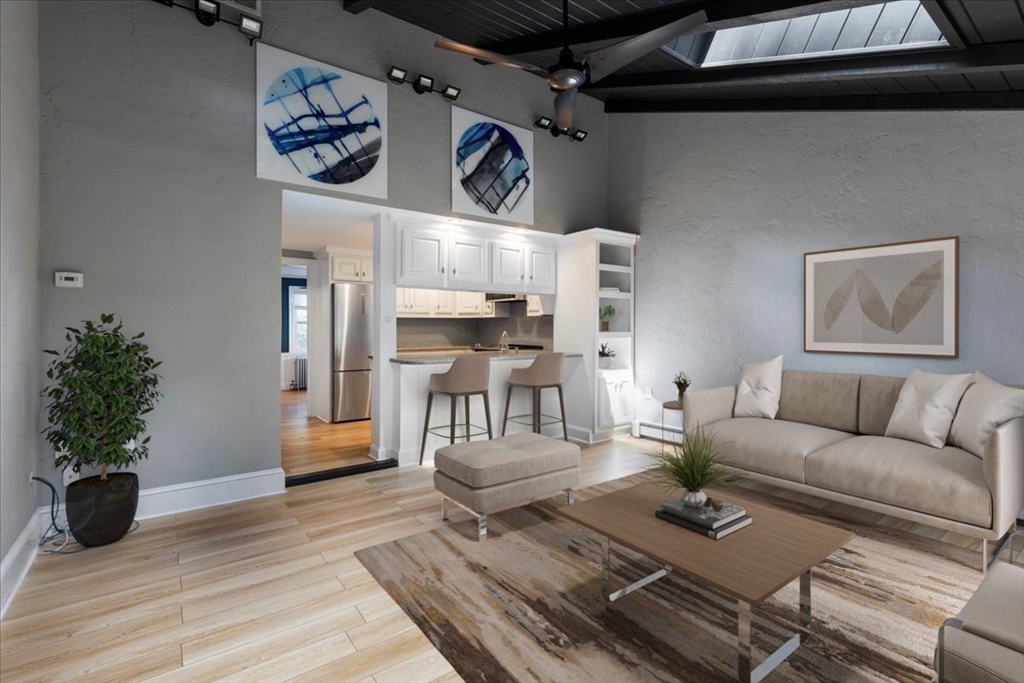 5 Windsor Road Stoneham, MA 02180 - Photo 14 of 37 a living room with furniture and wooden floor