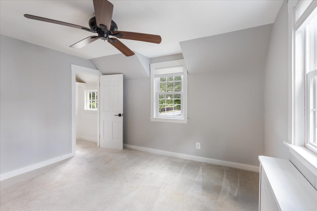 5 Windsor Road Stoneham, MA 02180 - Photo 22 of 37 a view of an empty room with a window