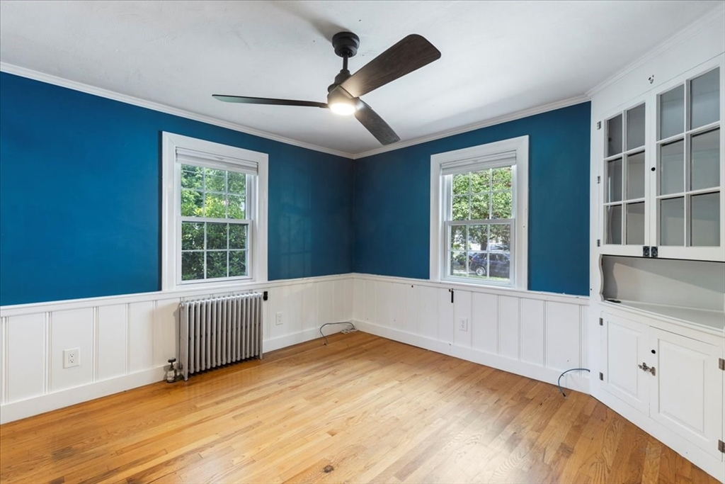 5 Windsor Road Stoneham, MA 02180 - Photo 8 of 37 a view of an empty room with a window