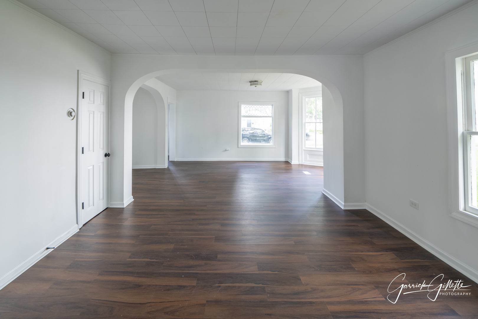 213 North Main Street Sandwich, IL 60548 - Photo 4 of 24 a view of an empty room with wooden floor