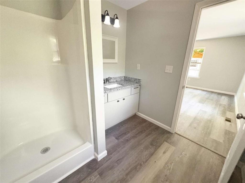 24 George Street Forsyth, GA 31029 - Photo 10 of 17 a bathroom with a shower and a sink