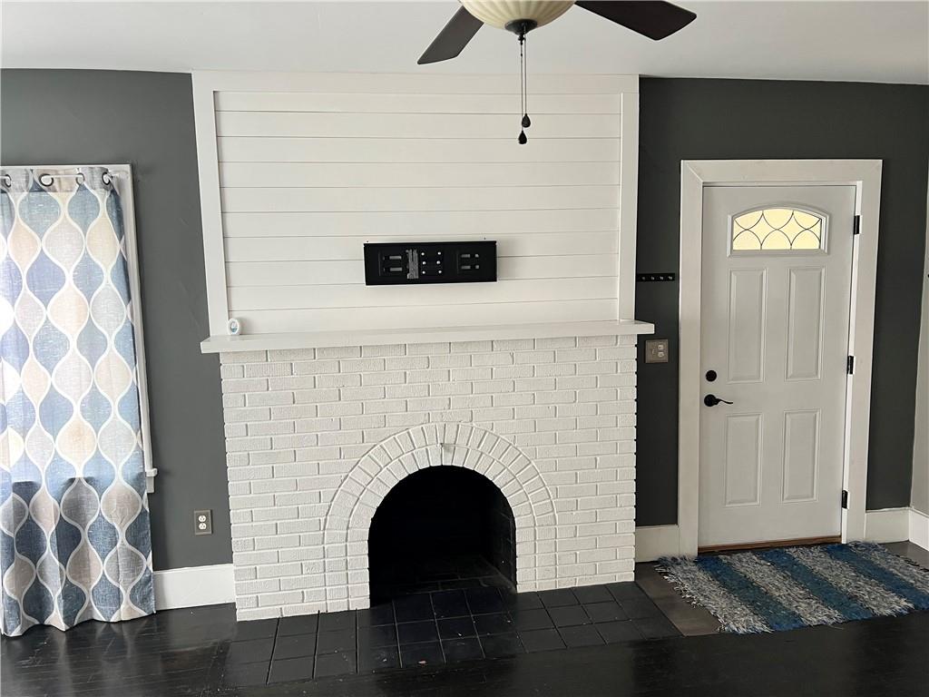 406 Service Avenue Sharon, PA 16146 - Photo 5 of 17 a living room with a fireplace and a wooden floor