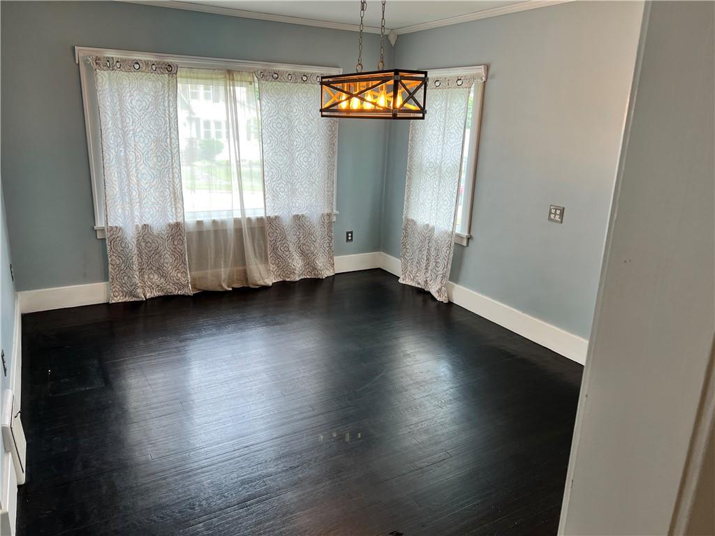 406 Service Avenue Sharon, PA 16146 - Photo 6 of 17 an empty room with wooden floor and windows