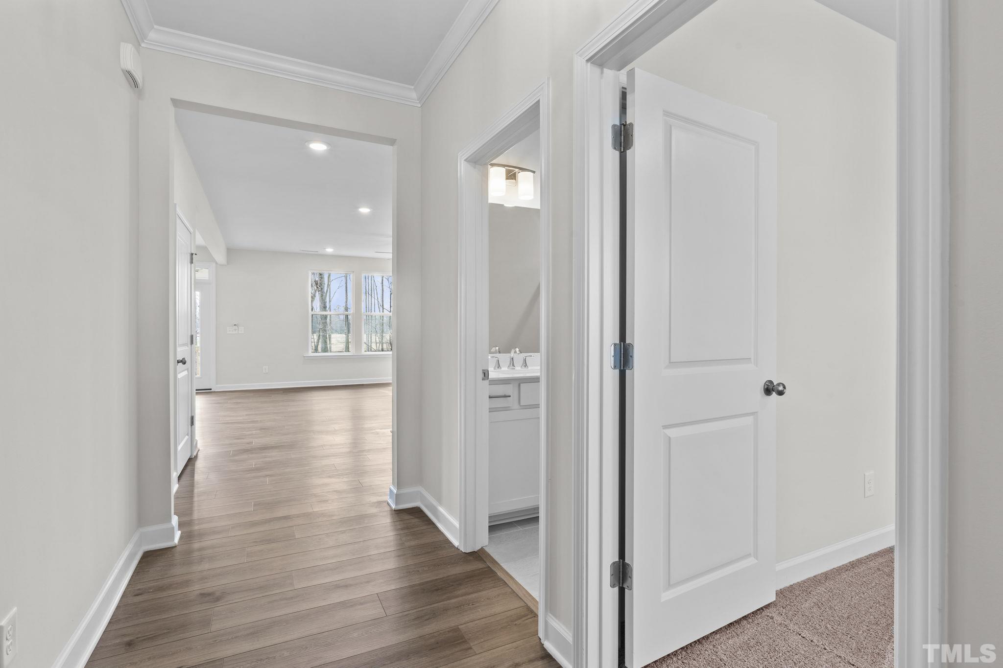 516 Craftsman Rdg Trail Knightdale, NC 27545 - Photo 17 of 45 a view of a hallway with wooden floor
